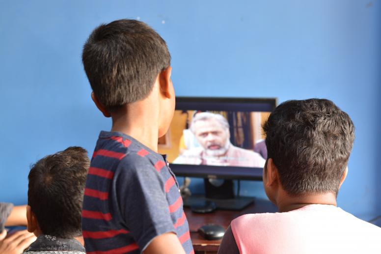 Boys watching videos in Deoghar, Jharkhand, India. © Ketaki Nagaraju/ICRW Asia