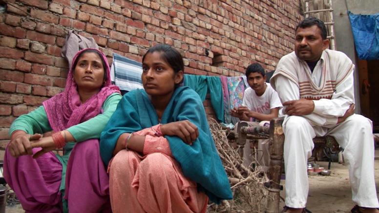 A family talking about adolescent girls and marriage in their community. A scene from the documentary film, A Fine Balance (2015), produced by ICRW and directed by Sanjay Barnela. ©ICRW