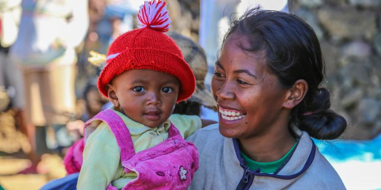 A young mother and her baby visit the local nutrition centre in rural Madagascar to participate in a discussion around children's nutrition and learn new cooking recipes that promote a varied diet. Credit: Mohamad Al-Arief/The World Bank.