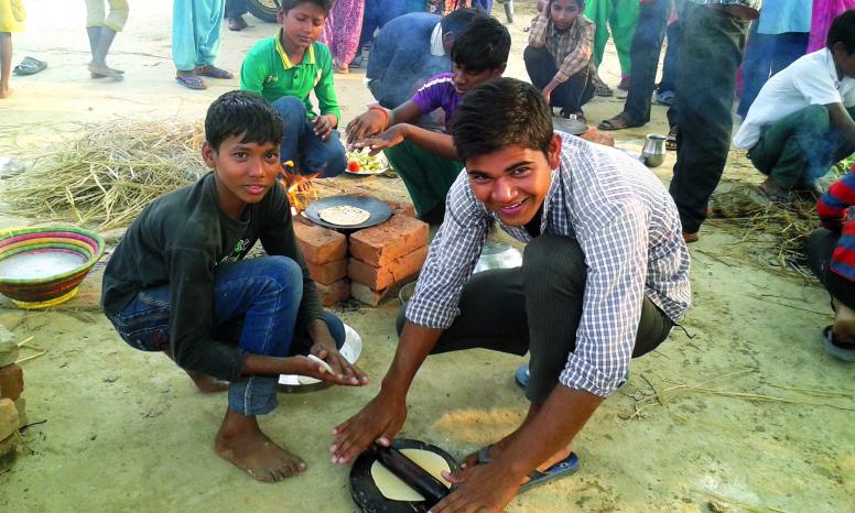 Boys take part in a cooking competition in Nepal